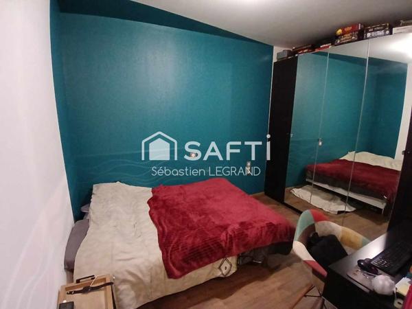 Appartement 3 chambres avec jardin, cave et parkings
