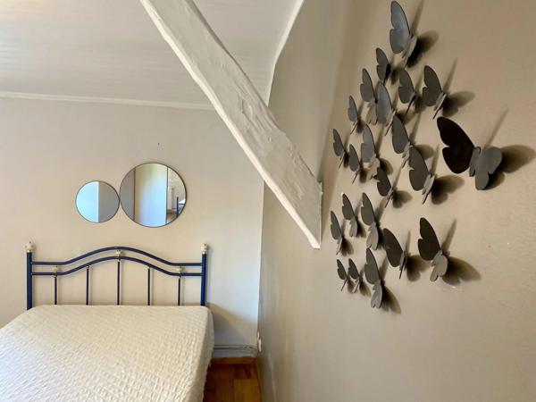 Maison de caractère avec vaste espace de vie et jardin clôturé