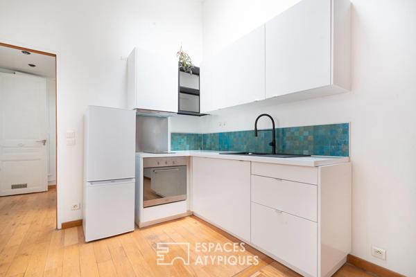 Esprit loft en dernier étage avec poutres apparentes
