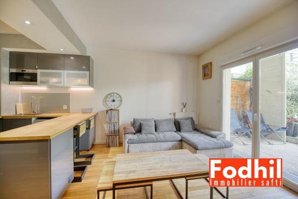 Appartement 3 pièces 62 m² avec terasse et jardin, parking et cave.