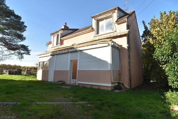 Maison à rénover avec terrain et potentiel